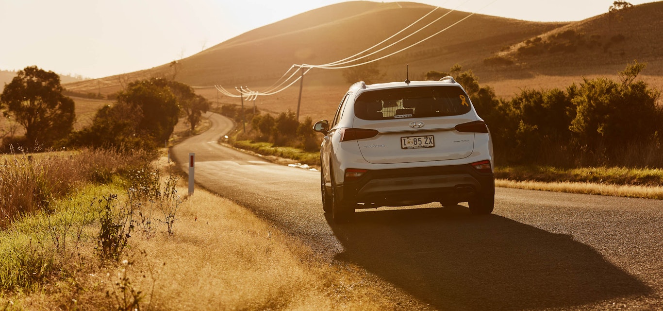 Car driving on scenic tasmanian roadside