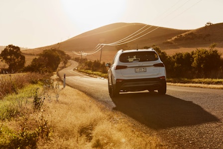 Car driving on scenic tasmanian roadside