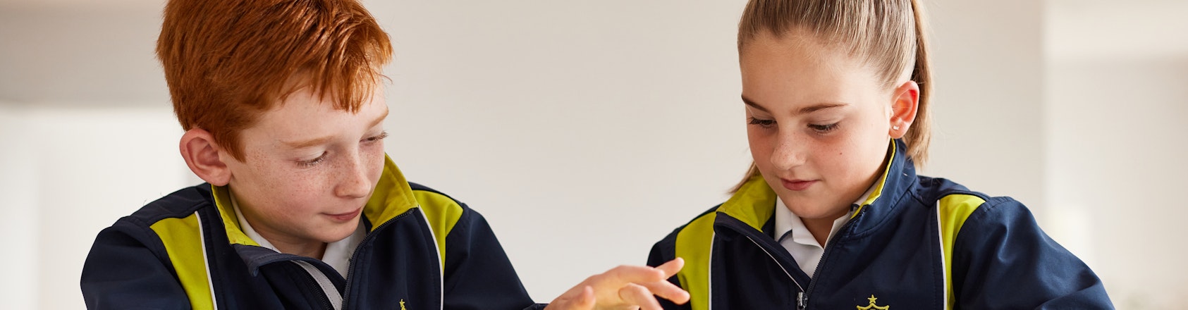 Children using their tablet devices.