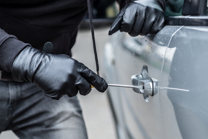 Attempting to break into car