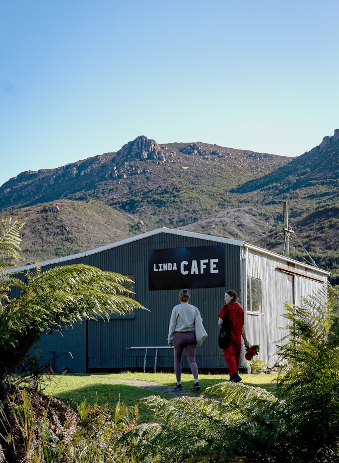 Linda Cafe can be found beside the blackened concrete shell of the short-lived Royal Hotel