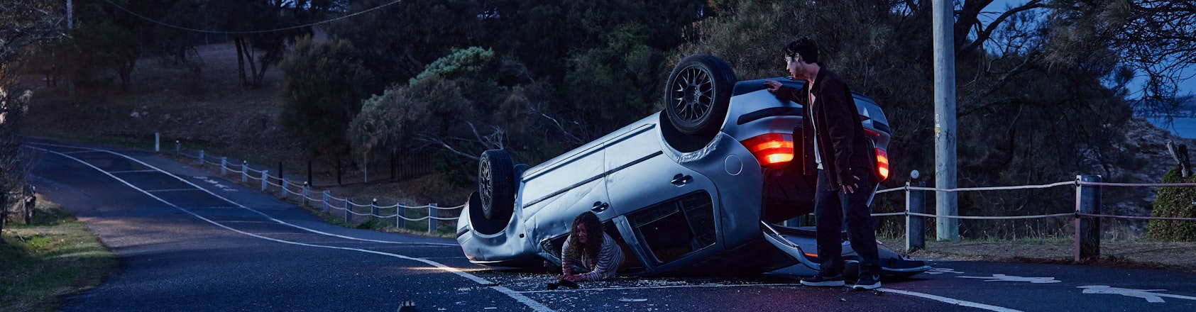 boy and girl escaping crashed car