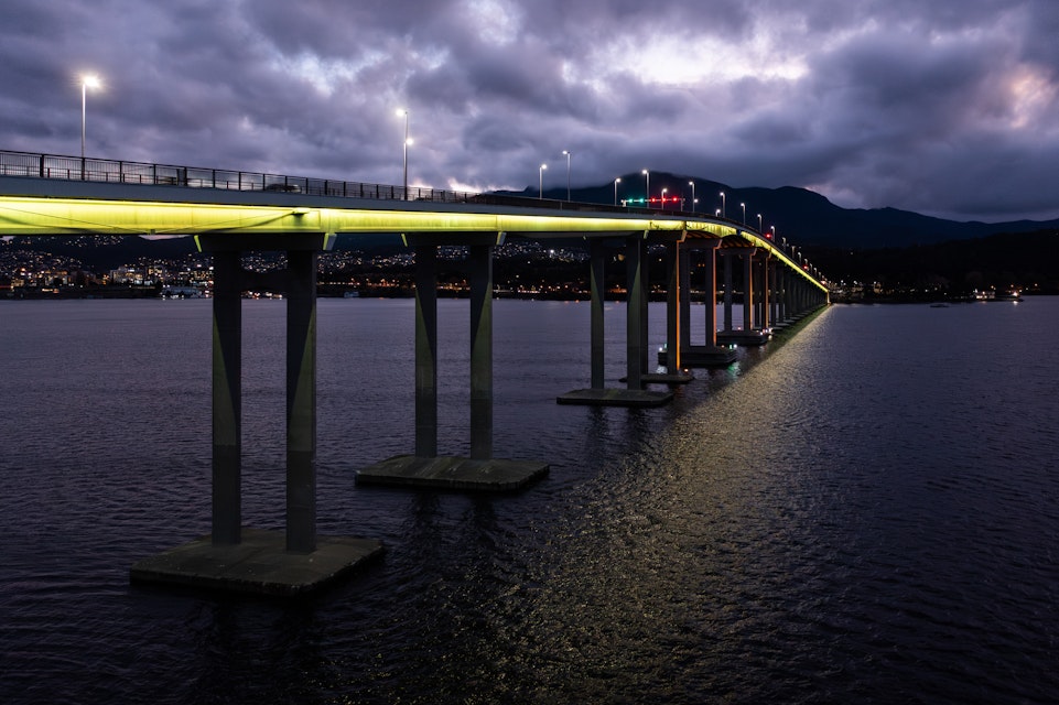 The Tasman bridge lit up yellow for National Road Safety week