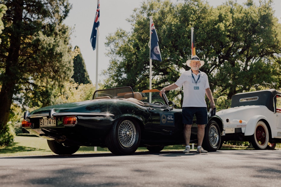 Attendee of the club run standing next to his vintage vehicle