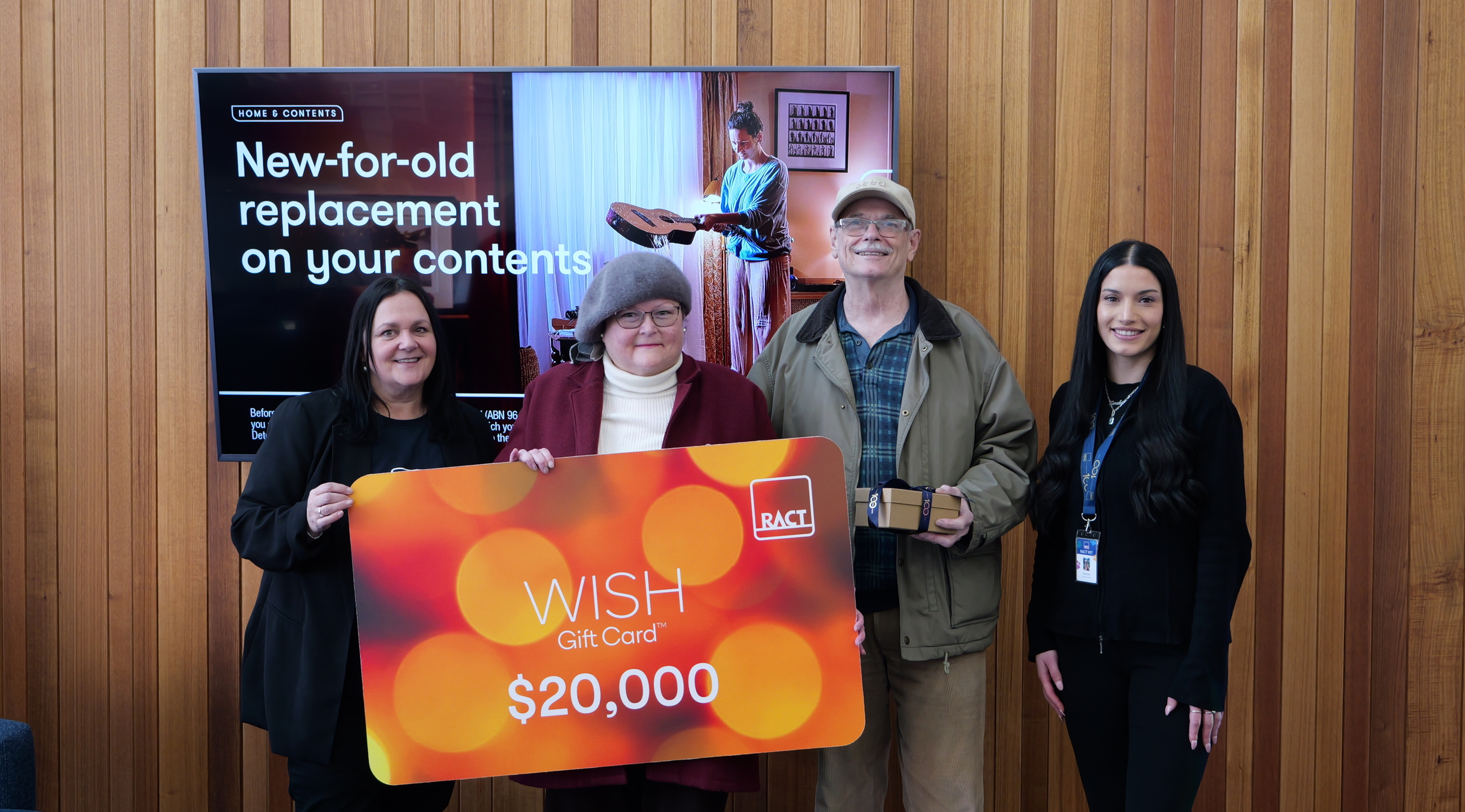 Insurance campaign winner with staff and prize