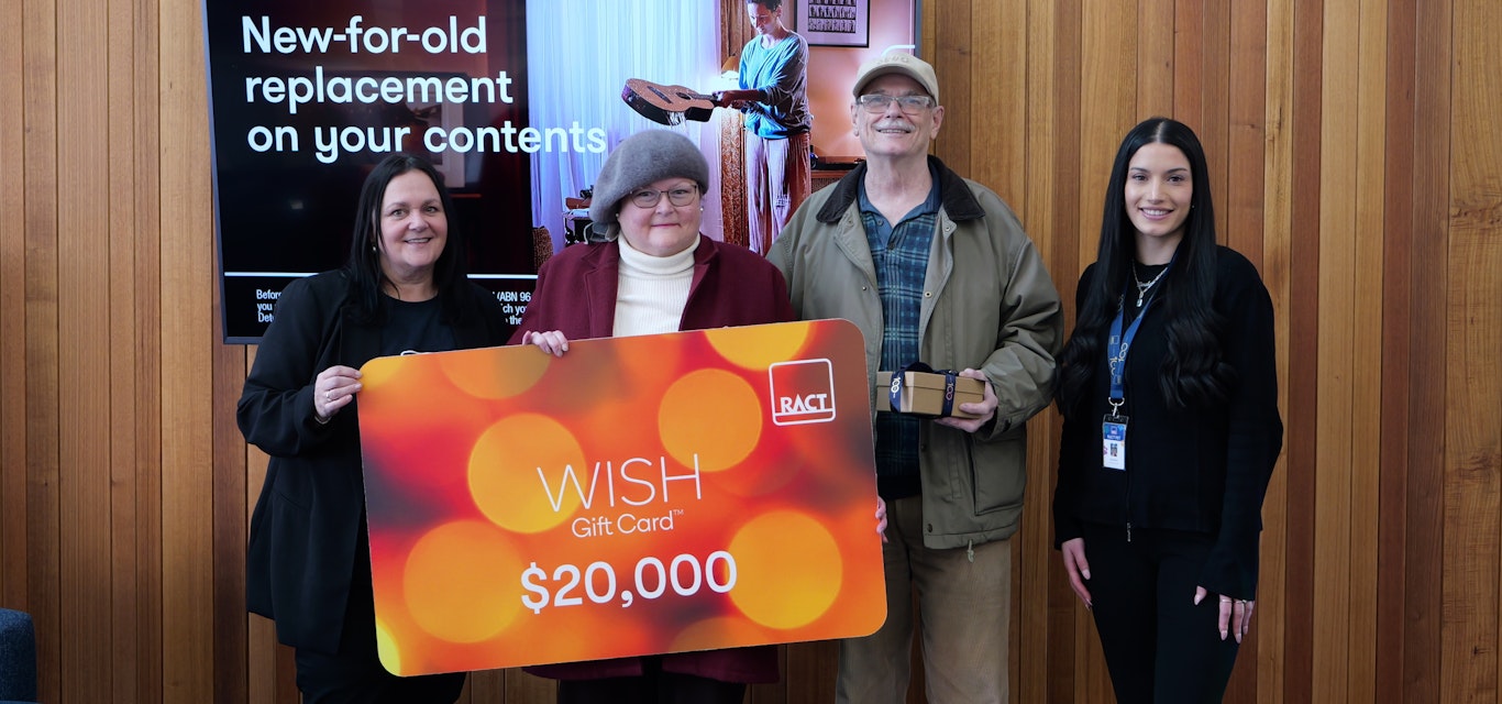 Insurance campaign winner with staff and prize