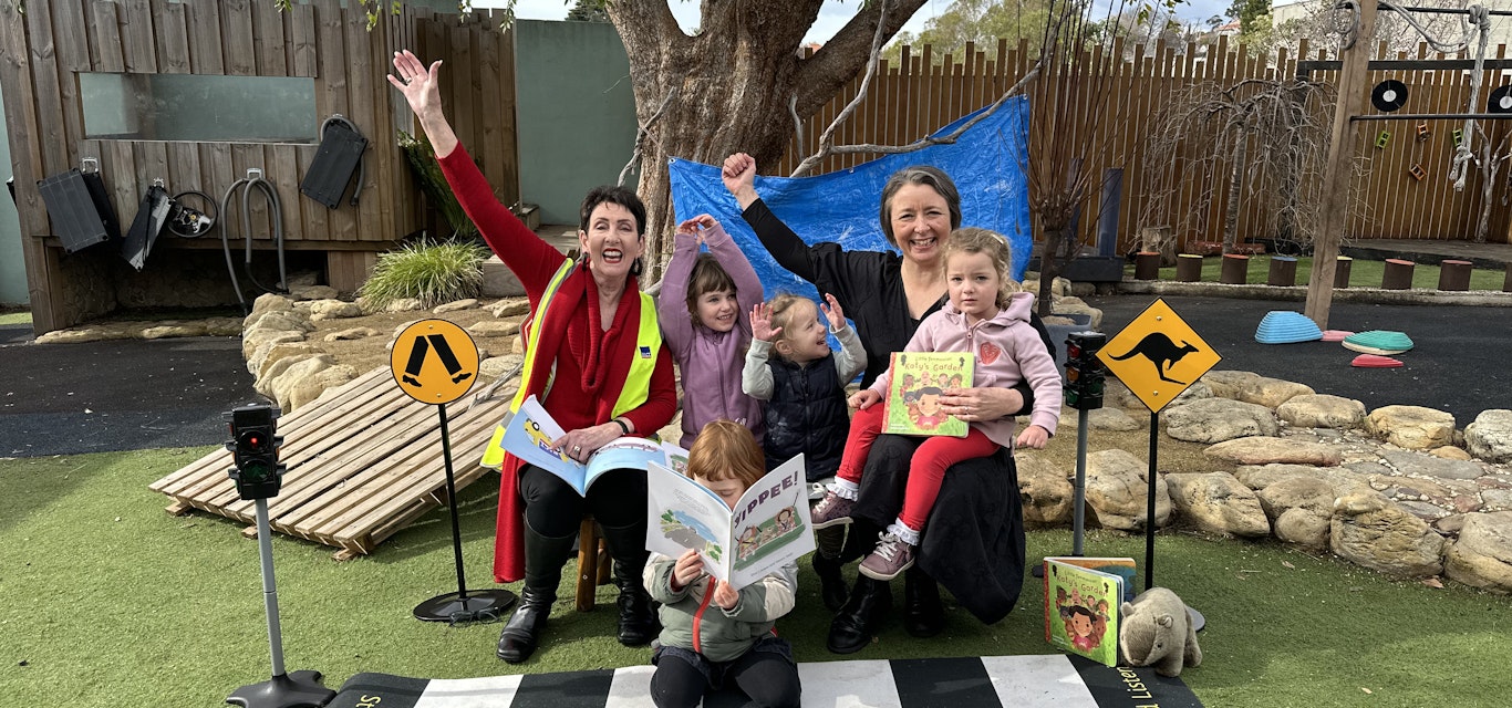 Robyn Moore with children at book week