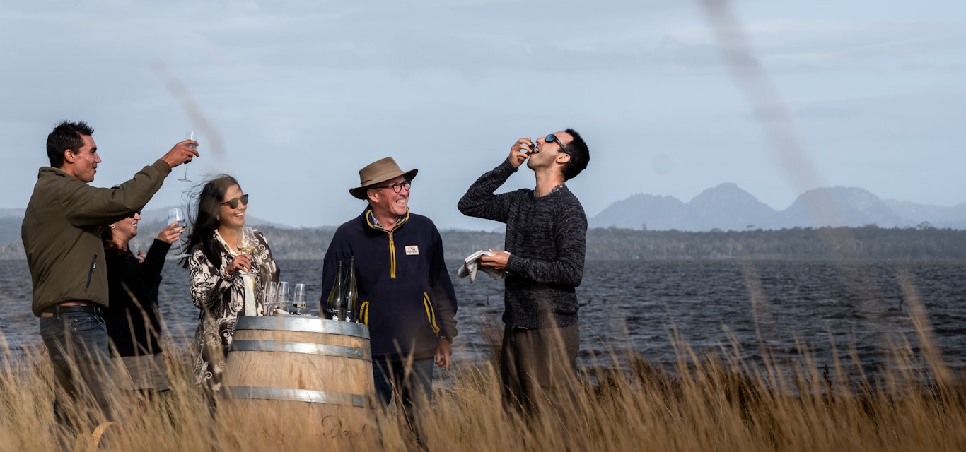 Waterside wine tasting, oyster shucking, gourmet lunch, and premium wines