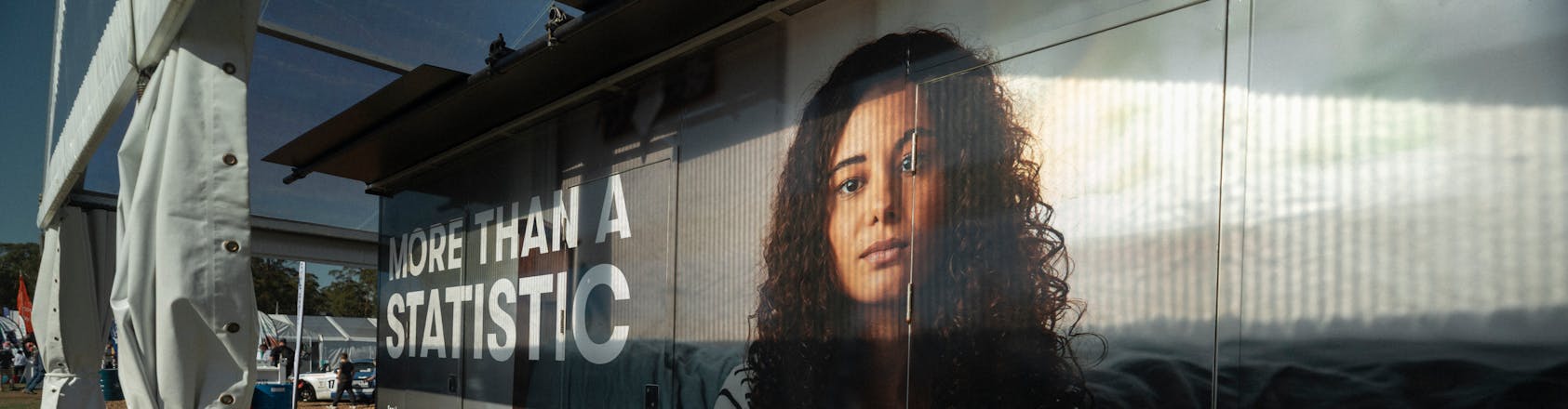 image of girl printed on box with text 'More Than a Statistic'