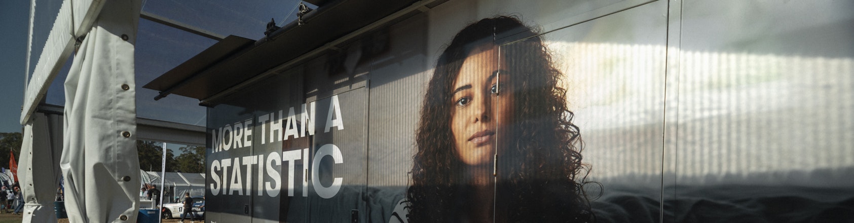 image of girl printed on box with text 'More Than a Statistic'