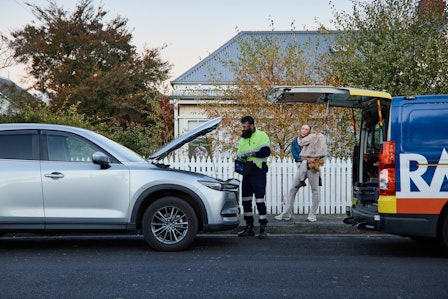 Roadside patrol helping member on the side of the road