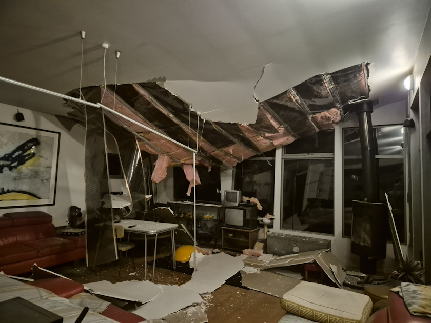 Damage to home interior after a tree fell during a storm