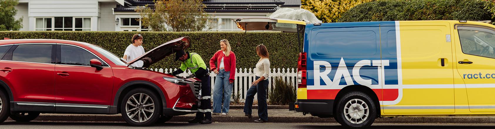 Roadside Young children on the side of the road being helped by a roadside patrol