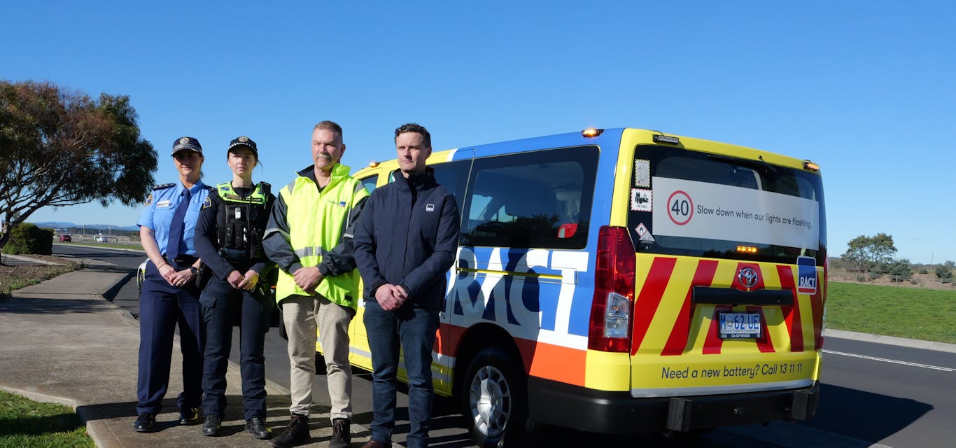 RACT and Tasmania Police advocate for Slow Down for Yellow RACT and Tas Police representatives in front of RACT van