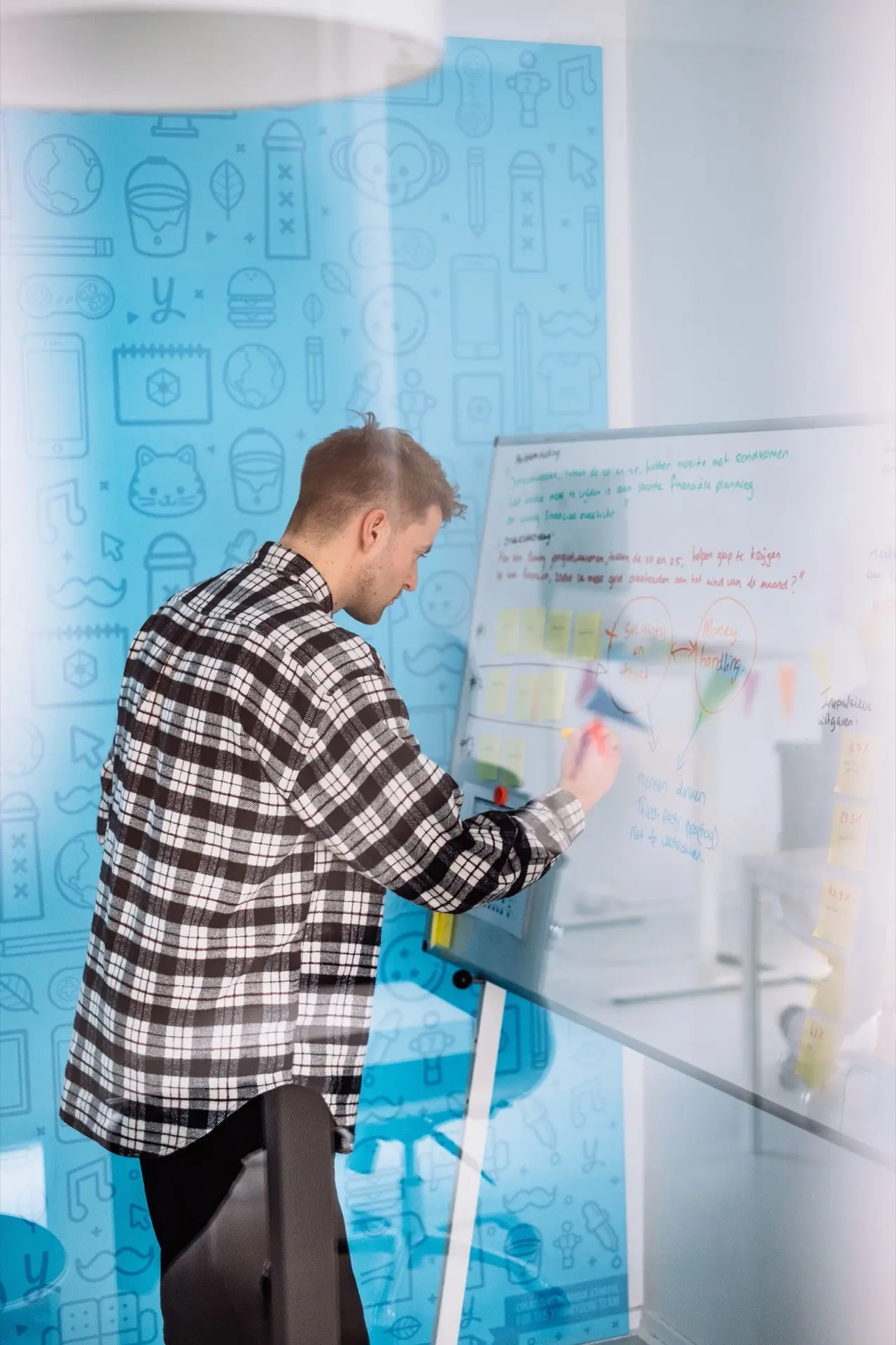 UX Designer writing on a whiteboard