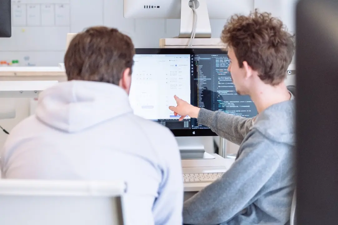 Yannick and Donovan discussing about code