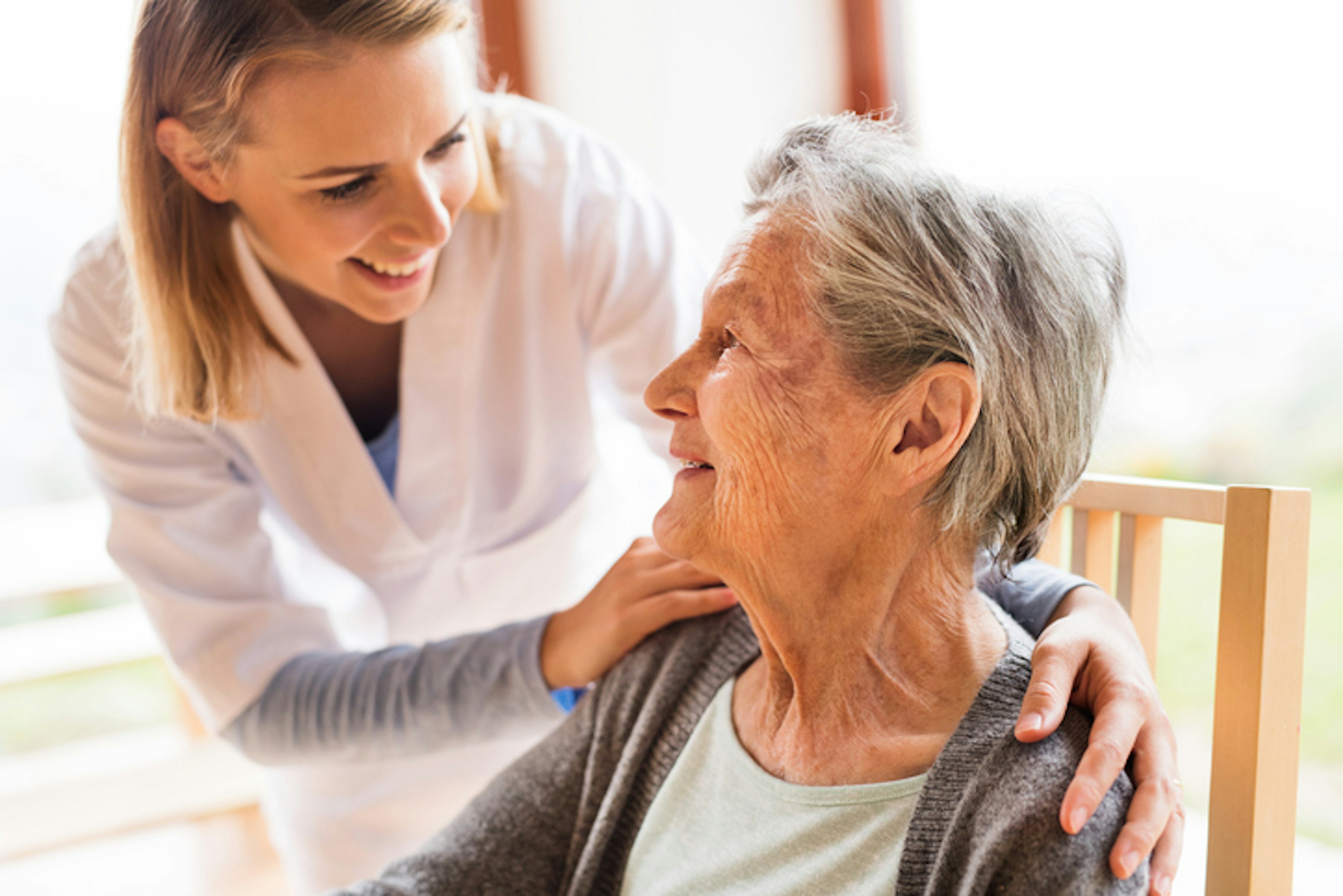 Kind healthcare worker with elderly patient
