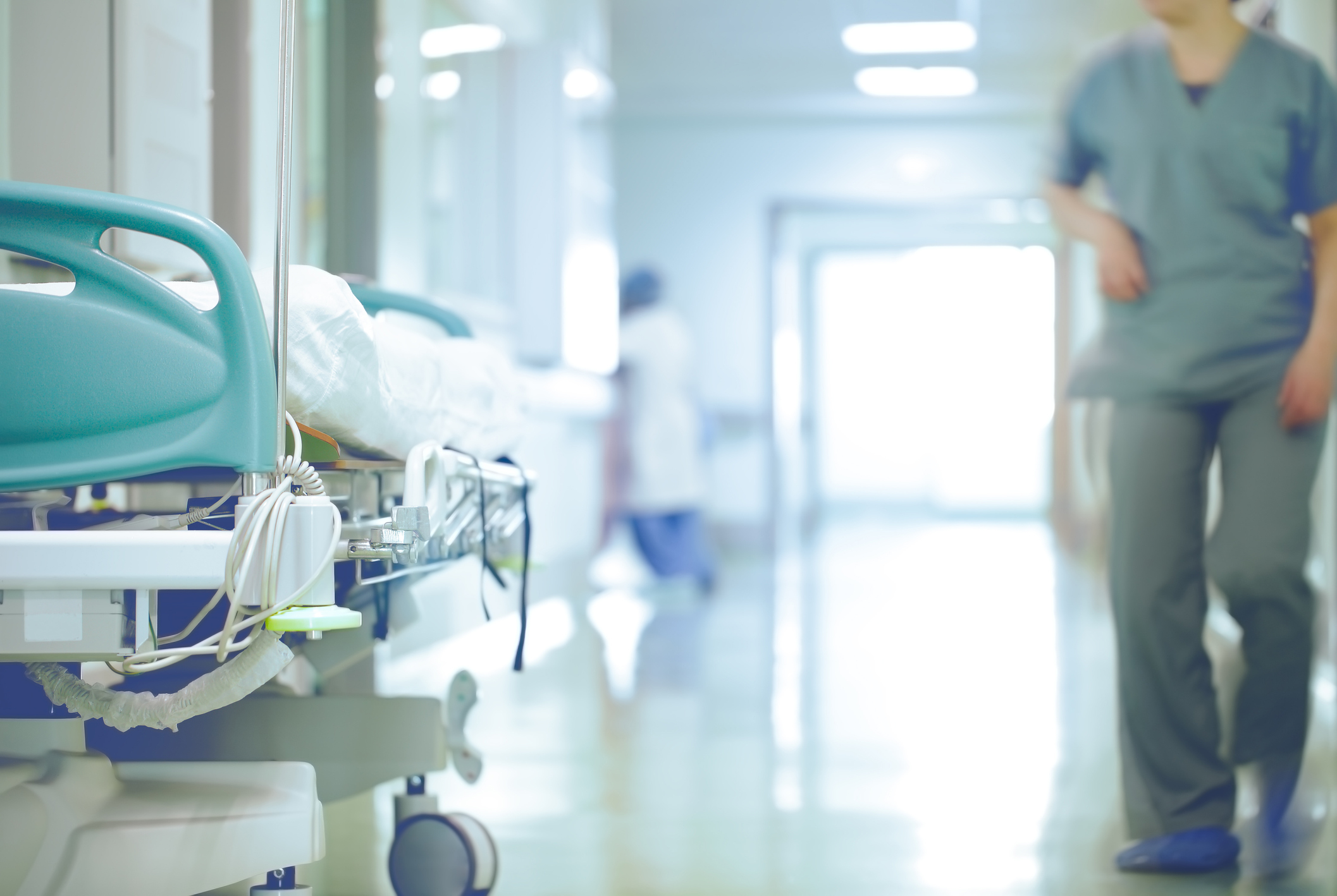 Hospital bed with busy worker