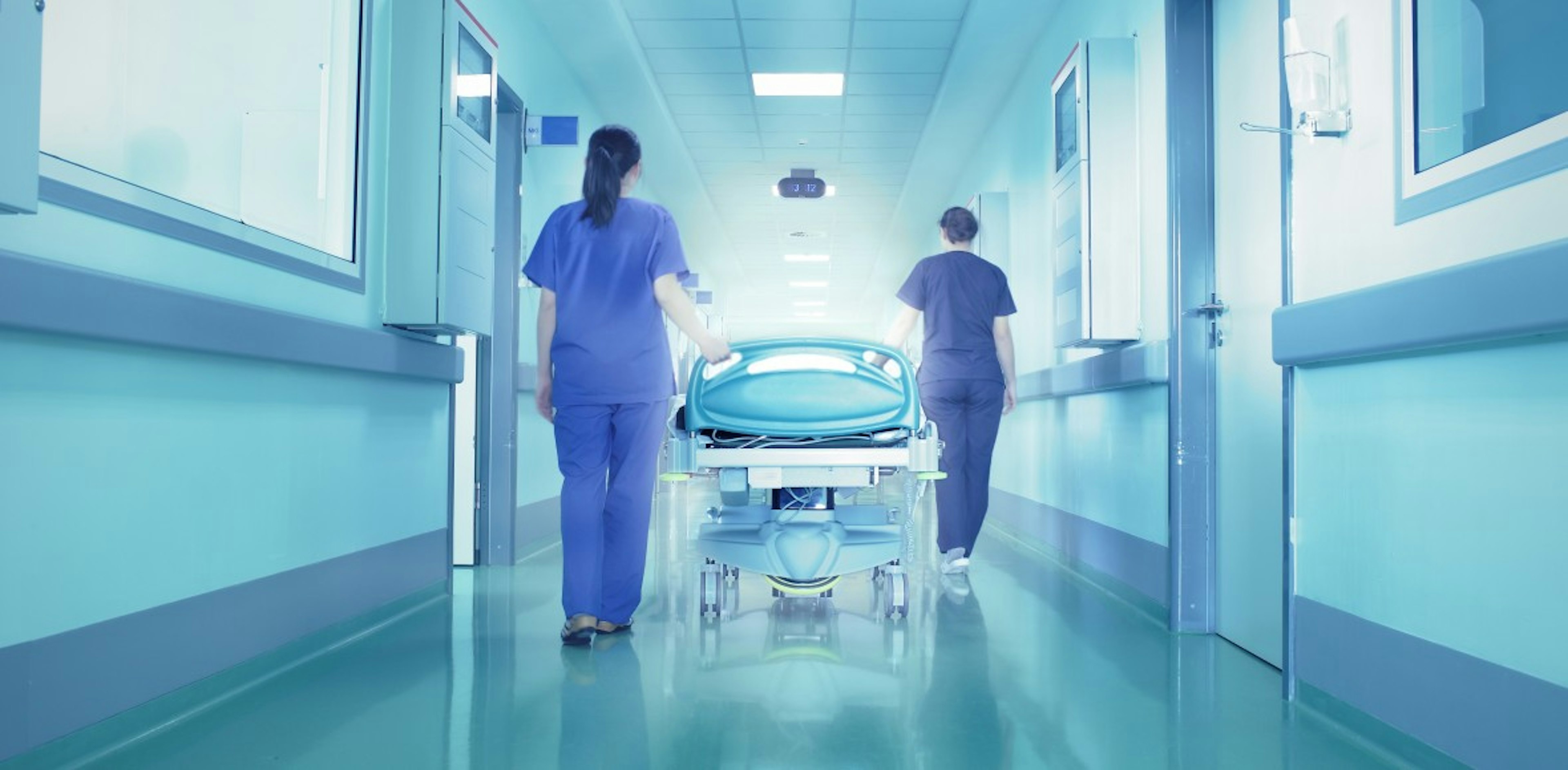 hospital workers with gurney