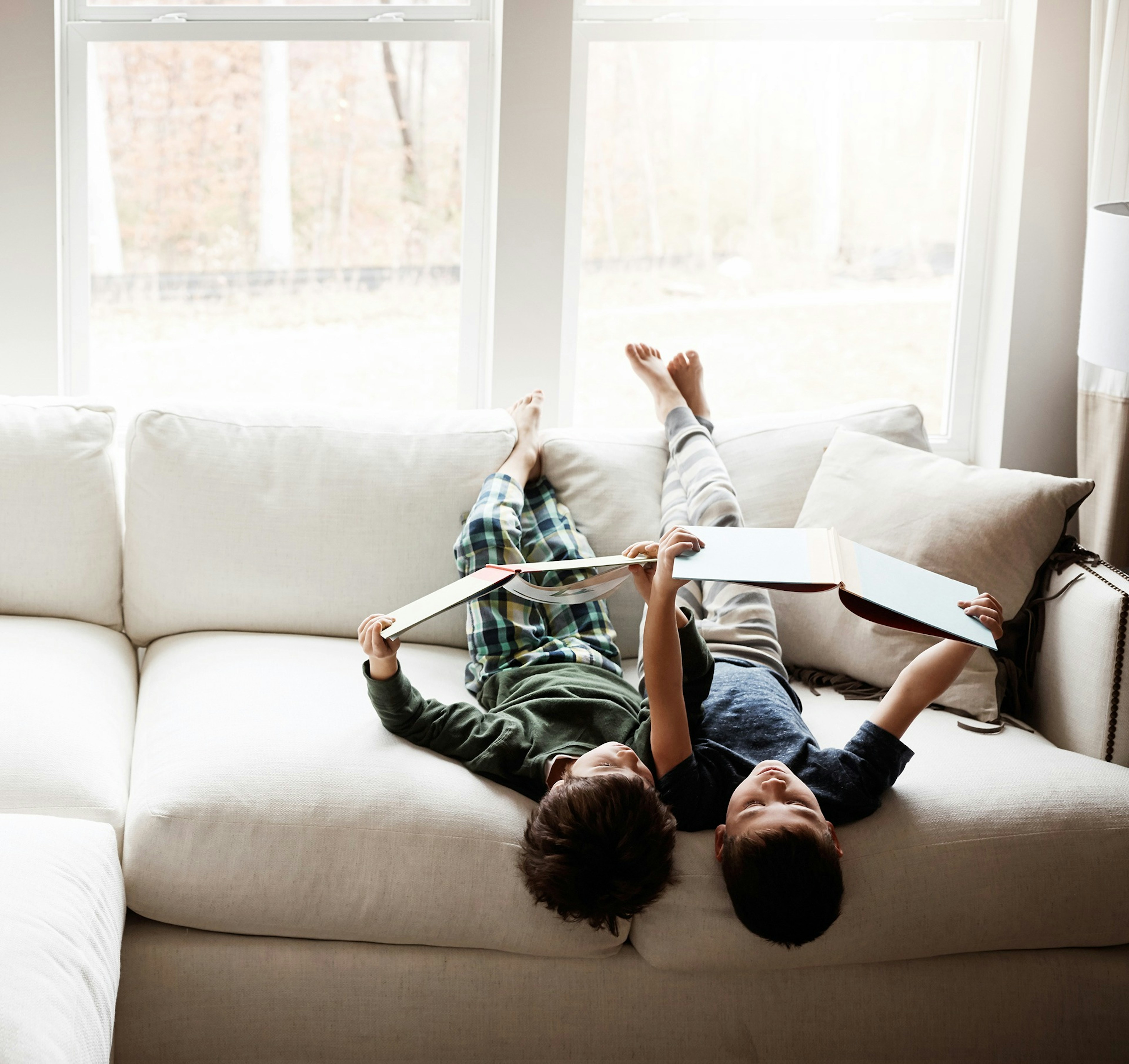 Boys on the couch reading