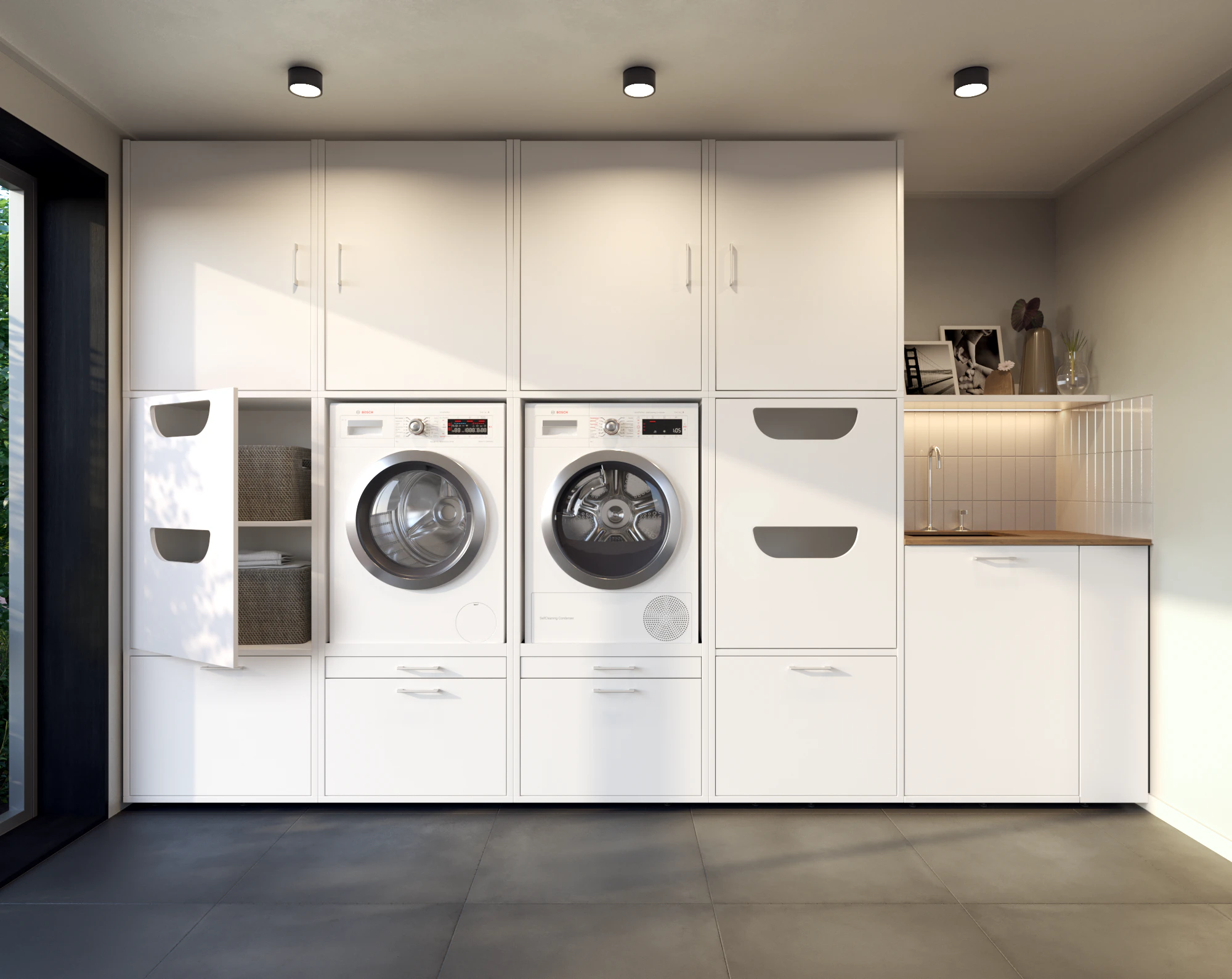 Lifestyle white washing machine and dryer wall cupboard with open laundry basket cabinet in scullery