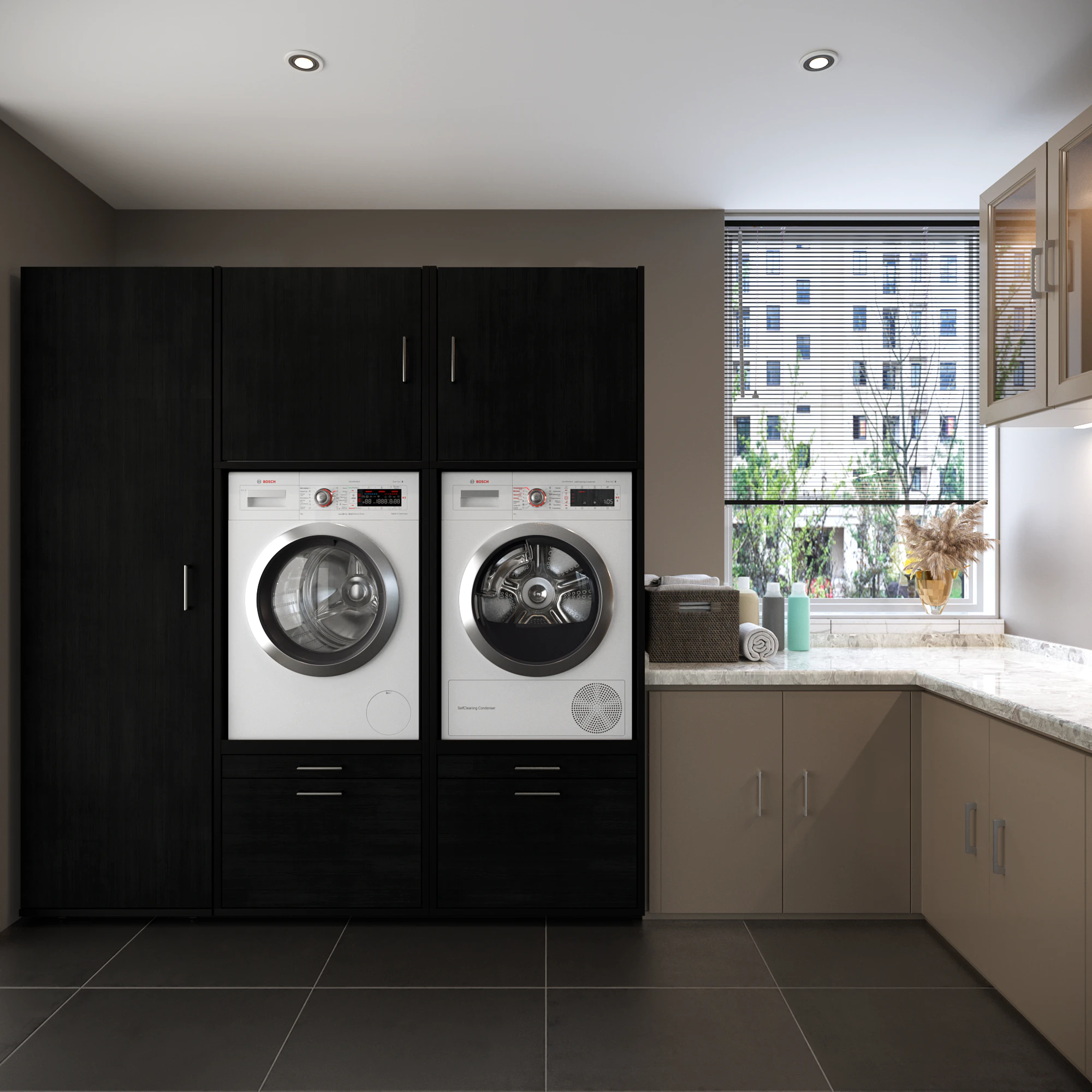 Lifestyle shot of black washing machine and dryer cupboard wall in situ in utility room