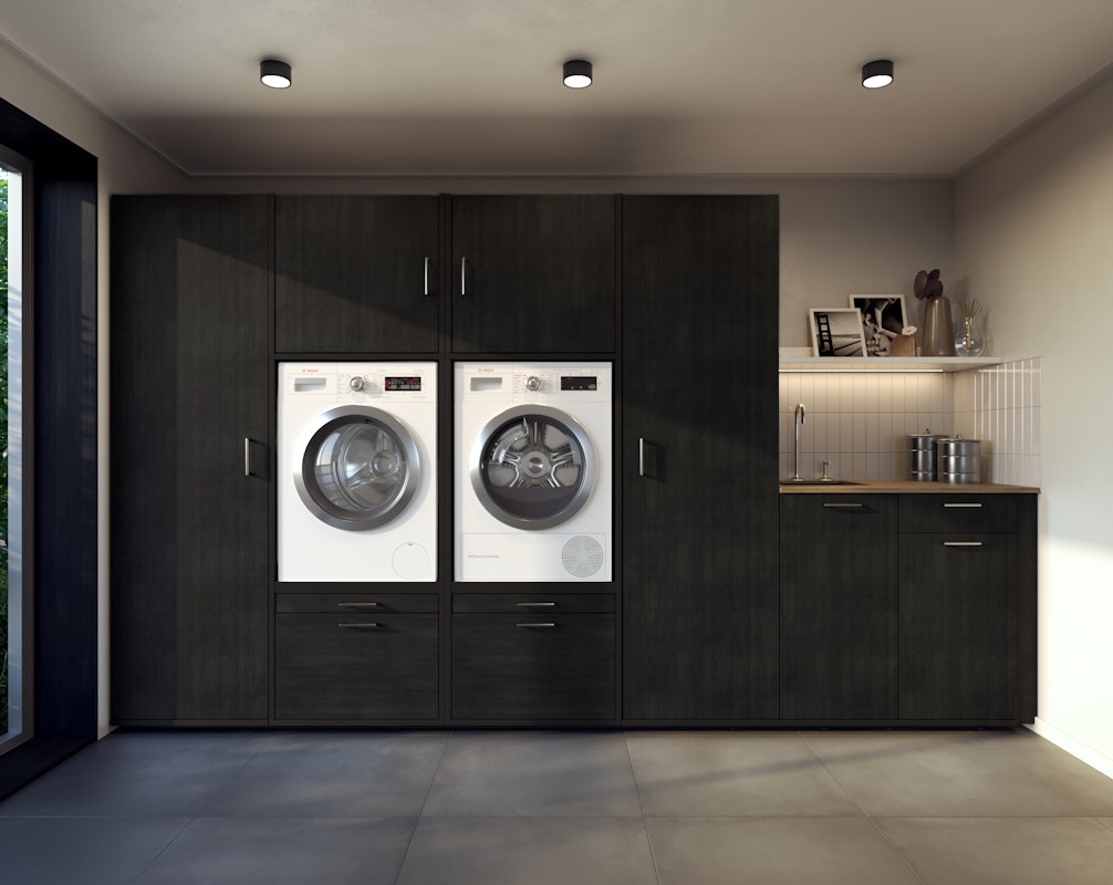 TÜV Rheinland zertifizierter schwarzer Waschmaschinenschrank mit Waschmaschine und Trockner nebeneinander