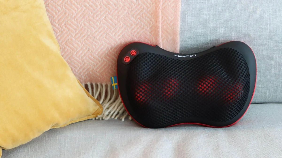 close-up of a flowpillow lying on a sofa