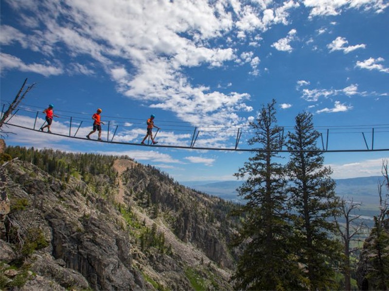 Hikers on a swinging bridge