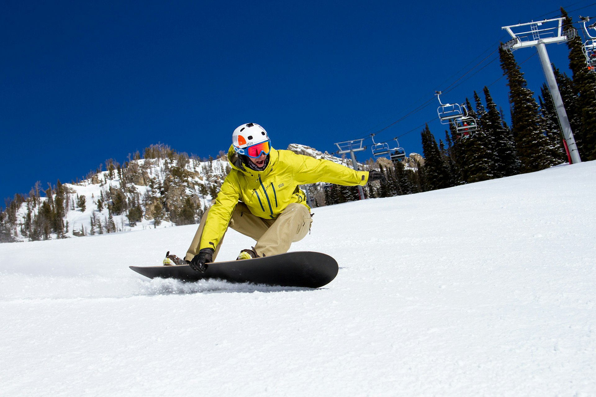Snowboarder ripping down casper