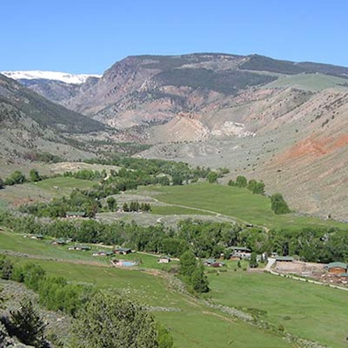 View of a ranch in mountain valley