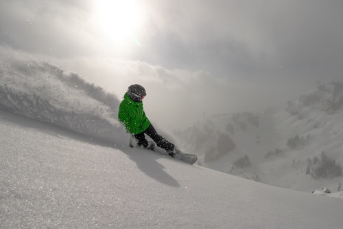 Snowboarding deep powder