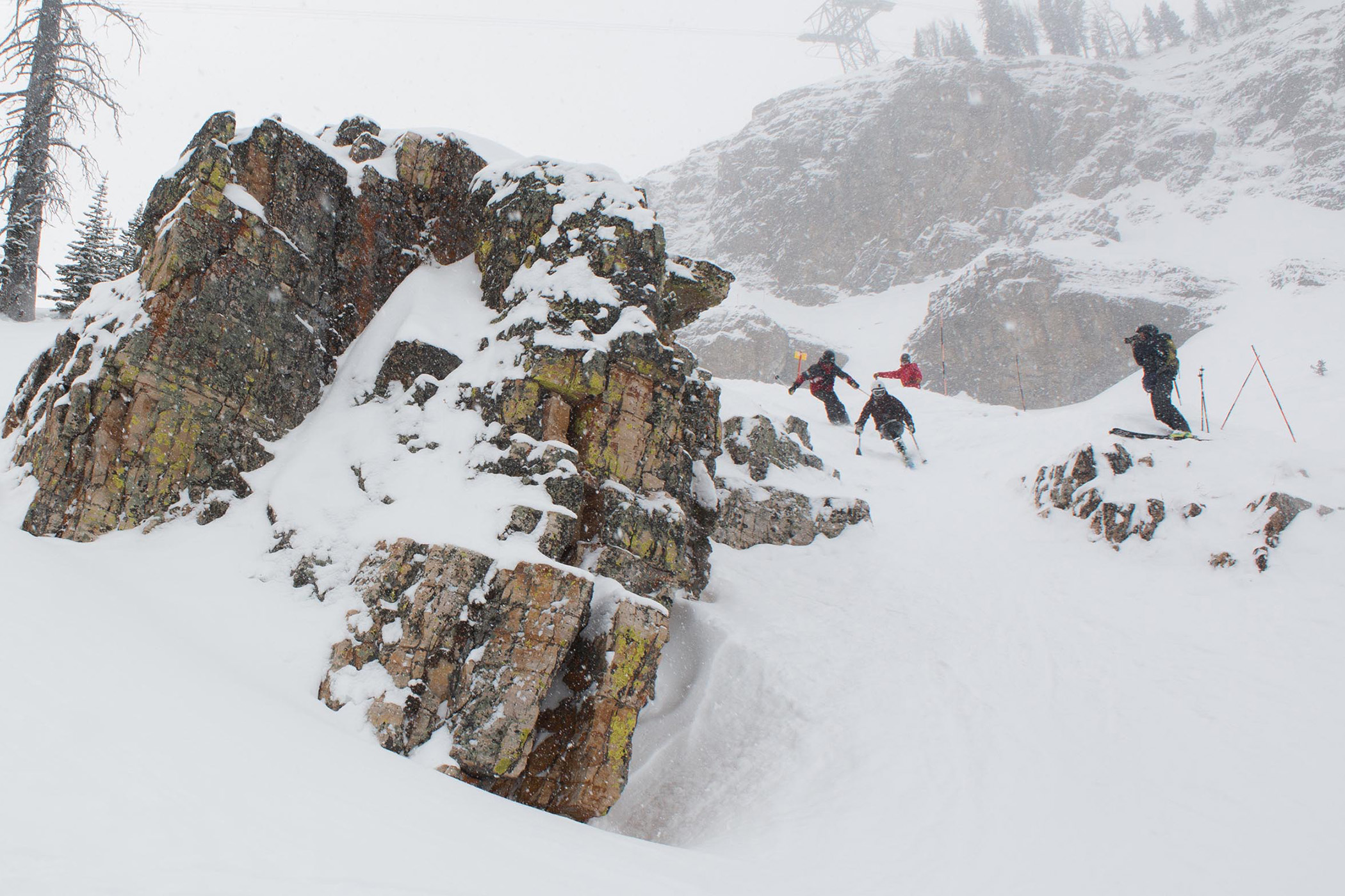 adaptive skier dropping in