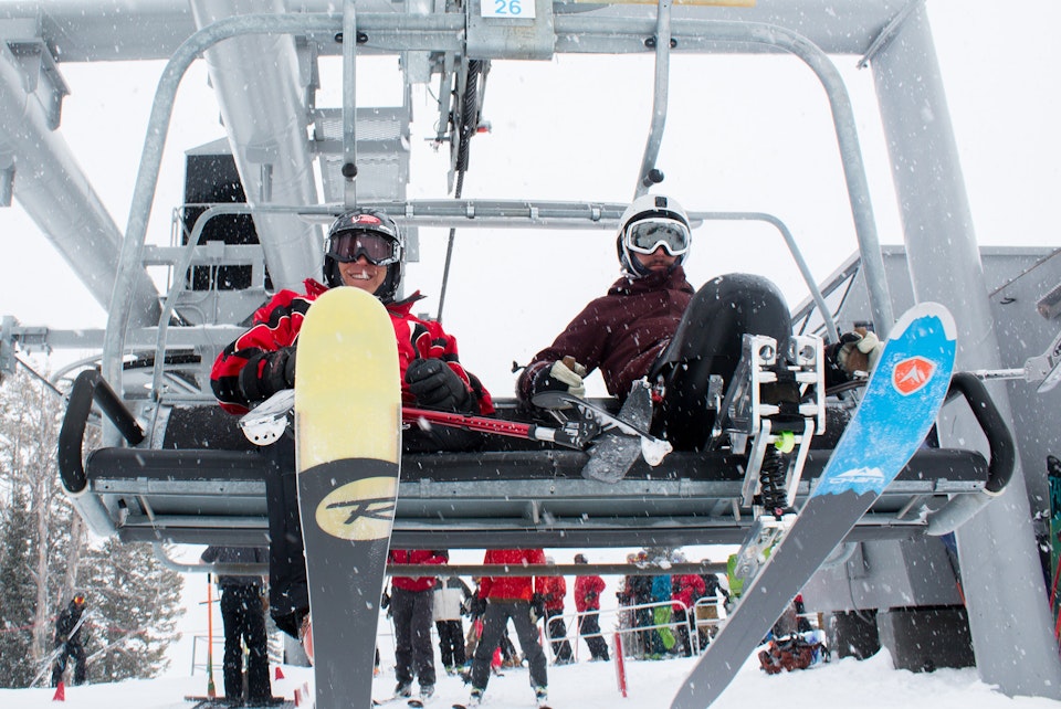 Adaptive skiers riding chairlift