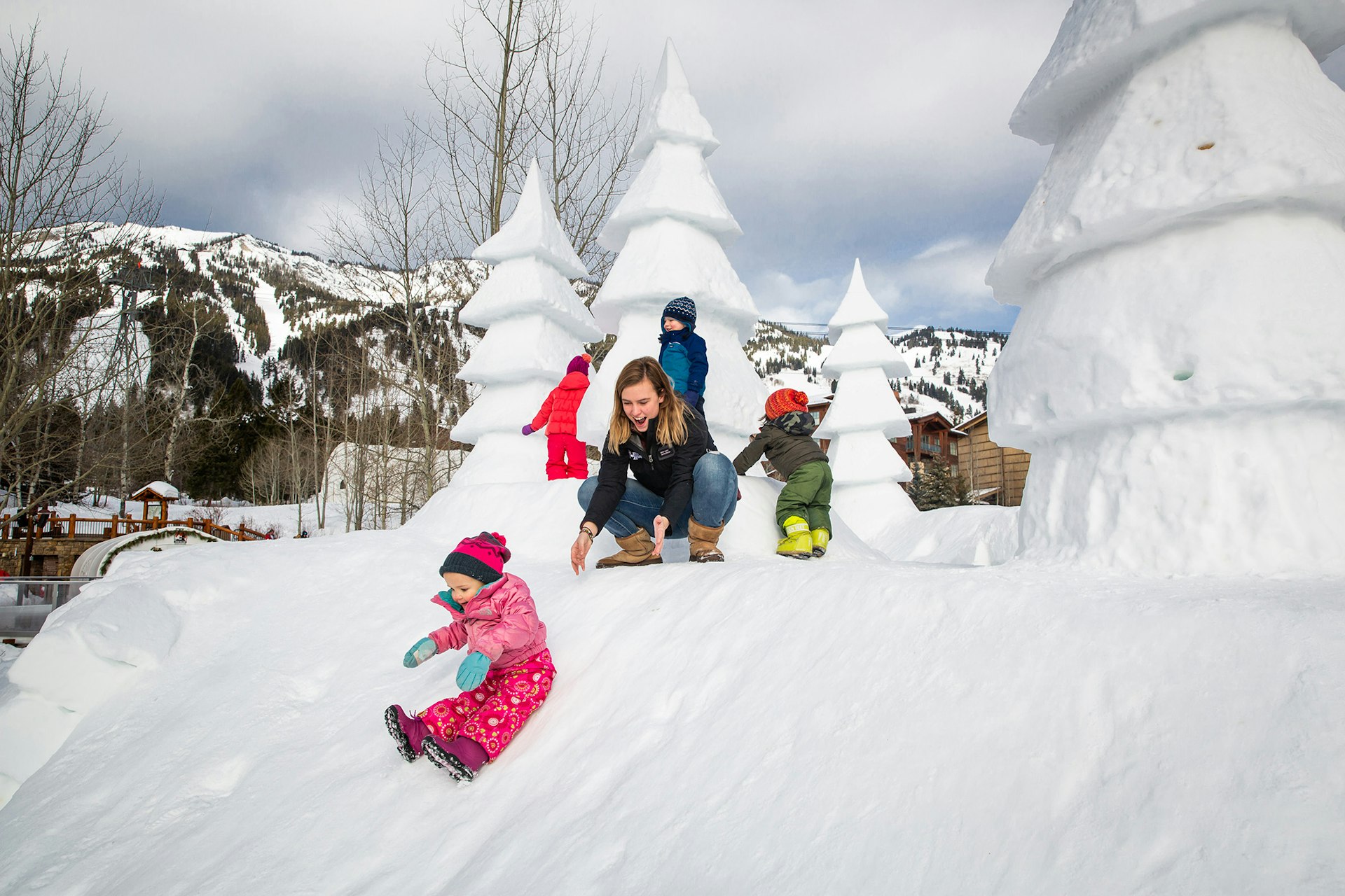 family and kids playing