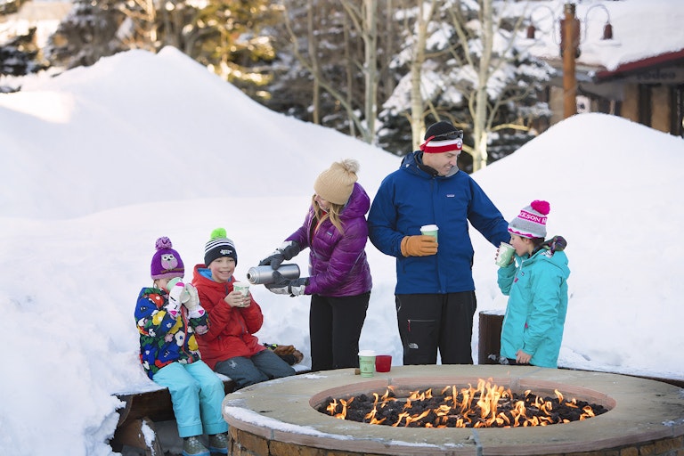 family around a fireplace