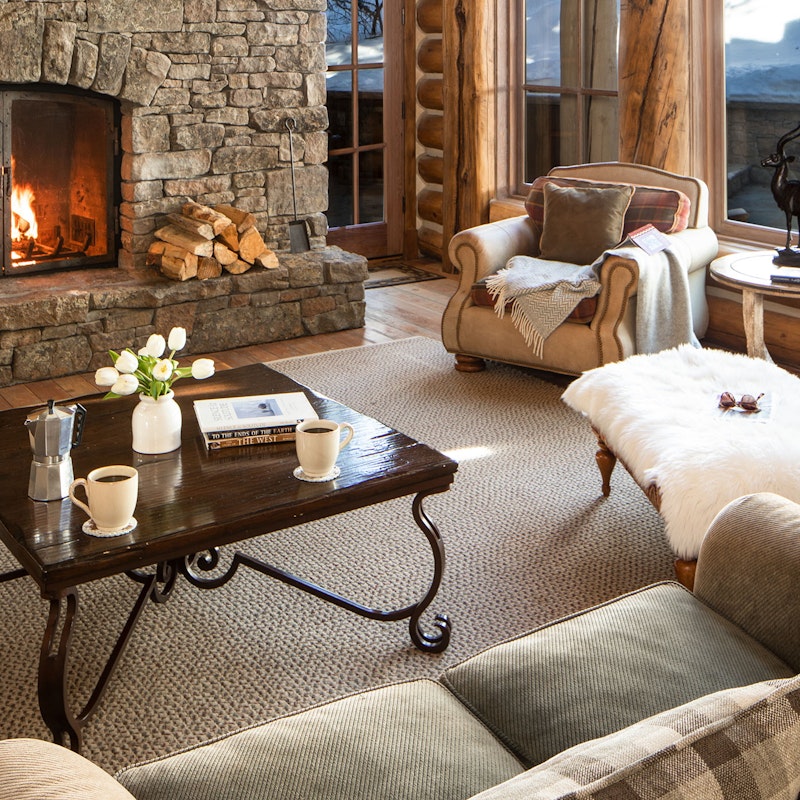 Slope side living room with cozy fireplace 