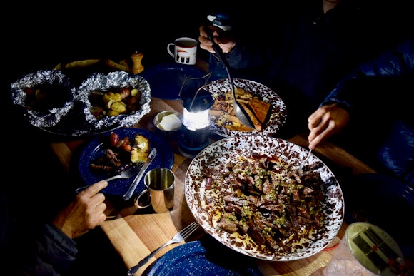 Our exceptional dinner of steak, baguette, and roasted veggies