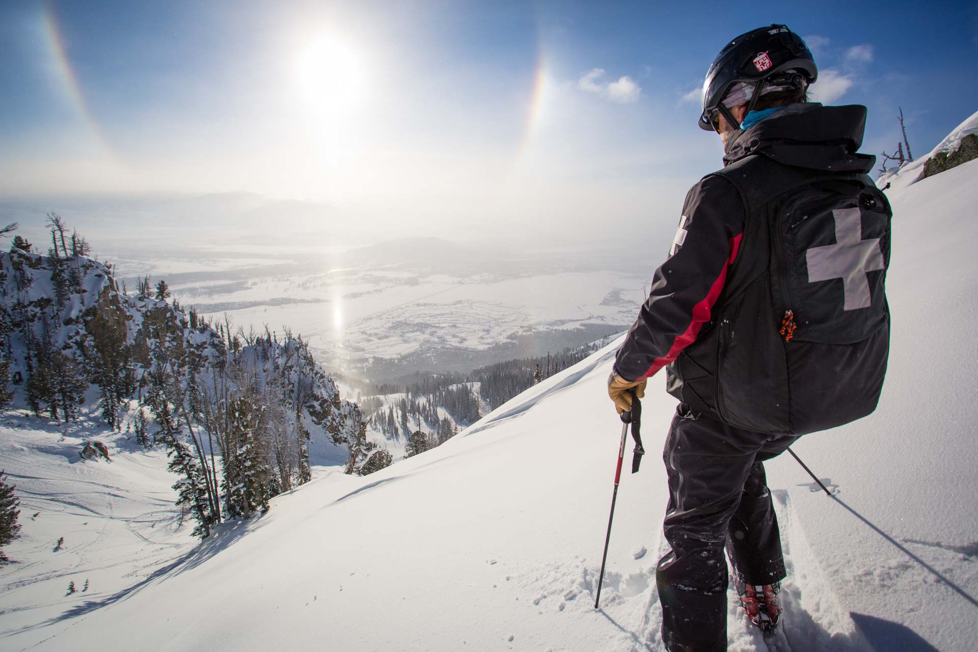Ski patrol looking down mountain