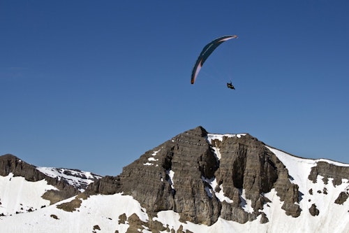 Person paragliding during the winter
