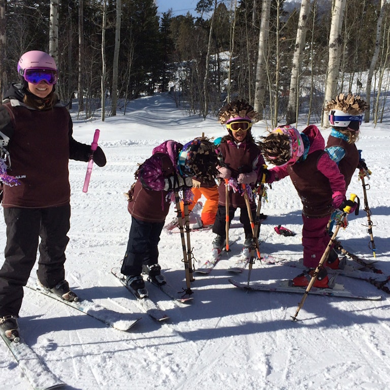 Kids skiing arounf
