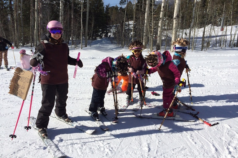 Kids skiing arounf