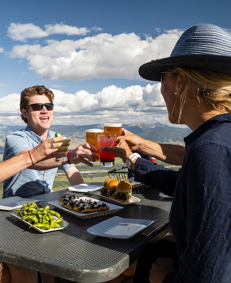 Group having cocktails on the Deck at Piste