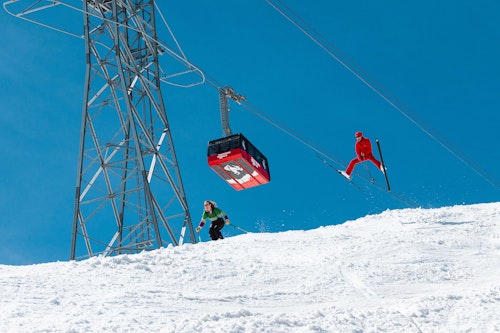 Retro themed skiing underneath the Tram