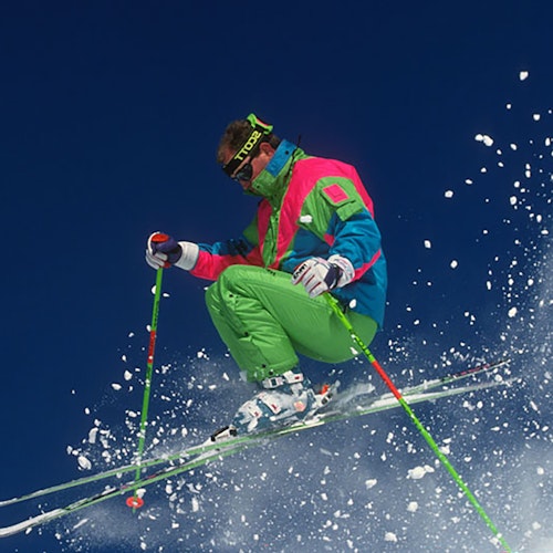 Skier in the nineties getting air