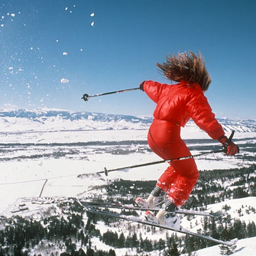 Female skier getting air in the seventies