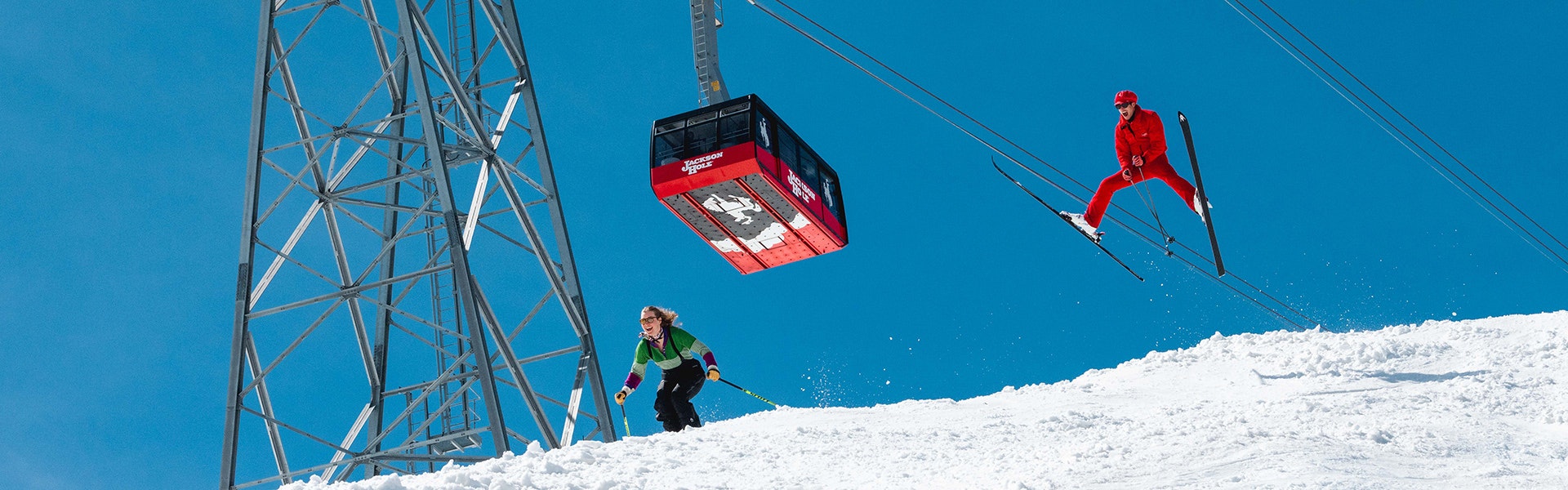 Retro themed skiing underneath the Tram
