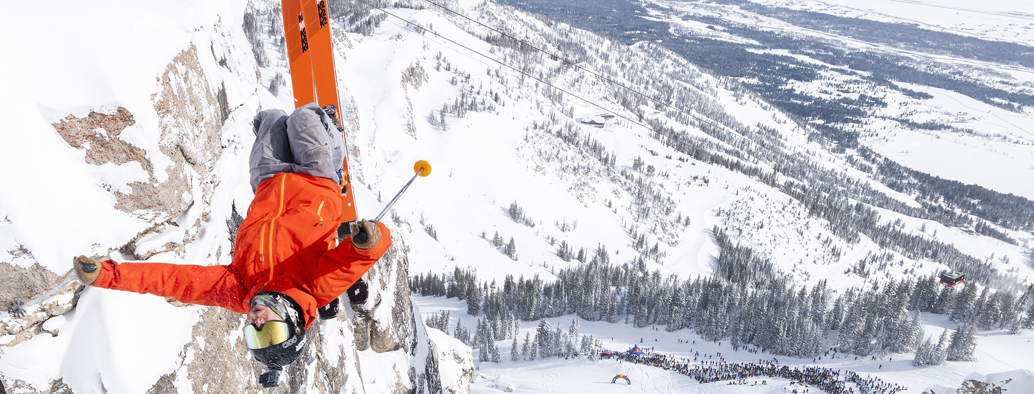 Skier doing a backflip into Corbet's