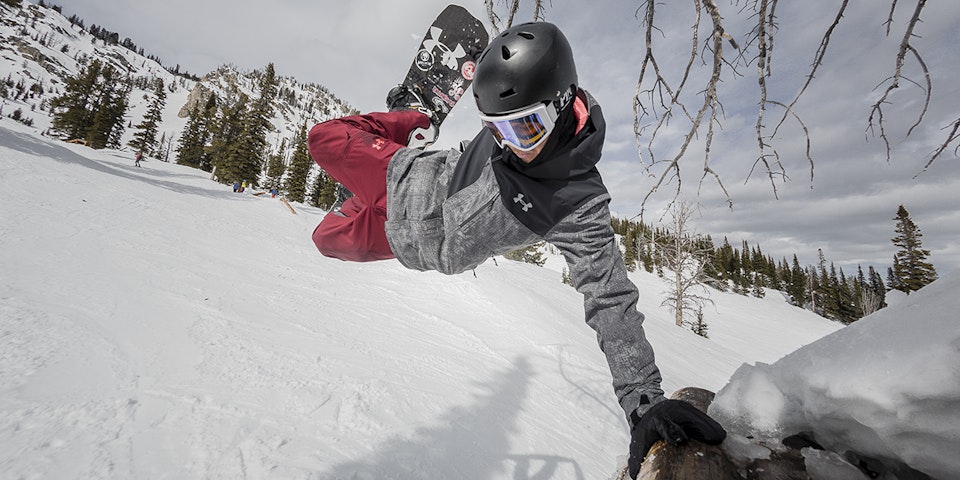 Snowboarder doing a grab in the terrain park