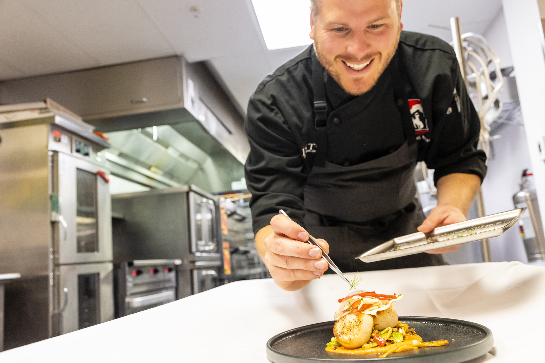Chef preparing a meal at Rendezvous Lodge